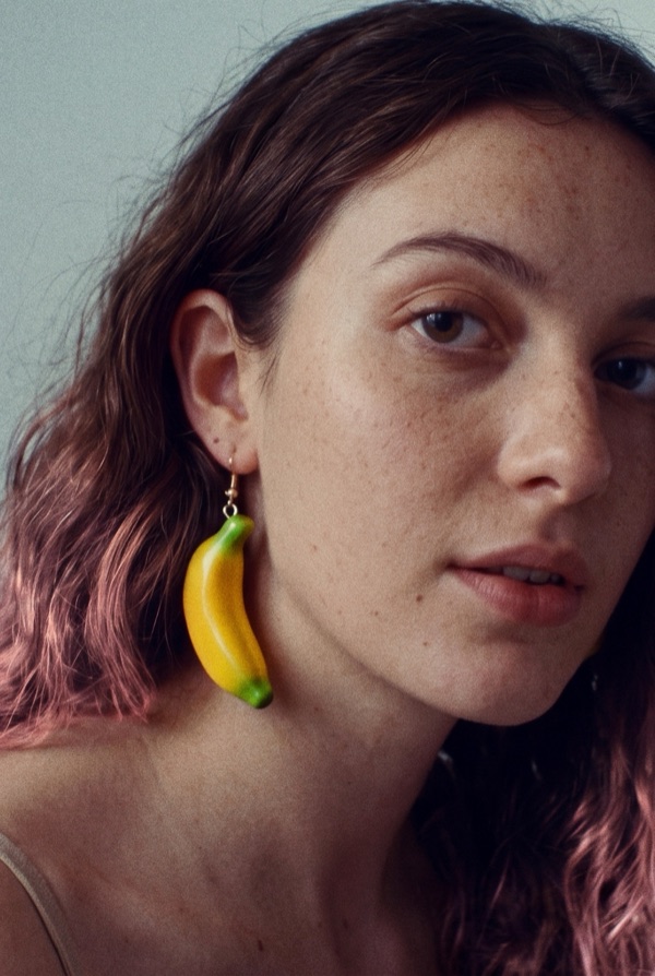 A portrait with a banana earring